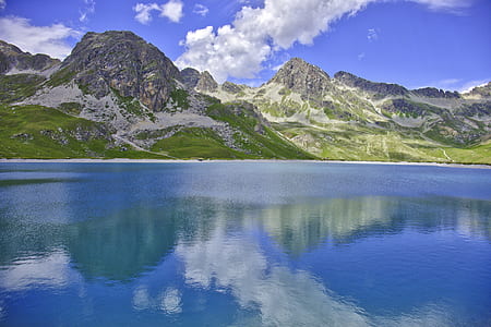 reflection photography of mountain alps and lake thumbnail