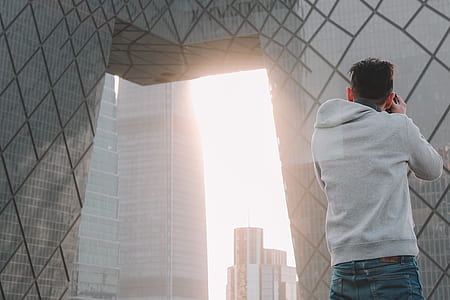 man taking photo of building outdoor thumbnail