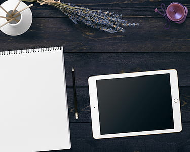 silver iPad on black surface thumbnail