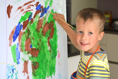 boy painting on paper thumbnail
