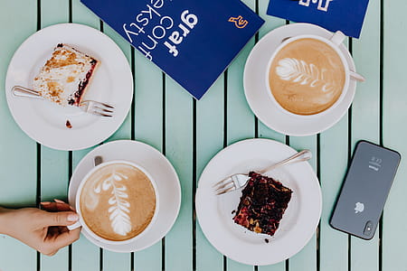 Drinking coffee and eating cake in a cafeteria thumbnail