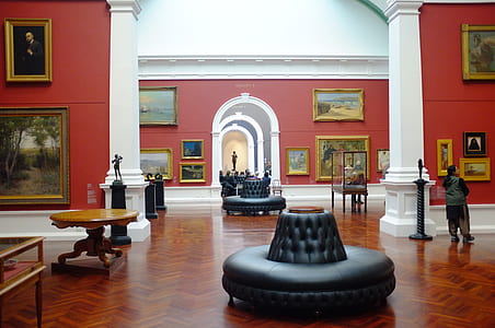 woman standing inside art gallery thumbnail
