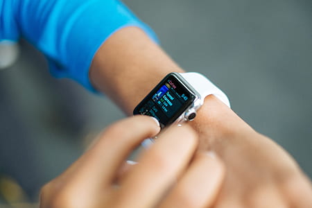 person holding black smartwatch thumbnail