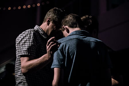 three men holding each other thumbnail