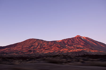 brown mountain under white clouds and blue sky thumbnail