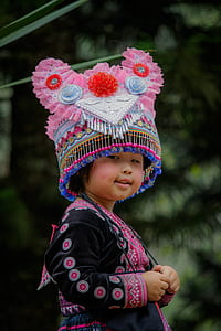 girl in pink and blue traditional headgear thumbnail