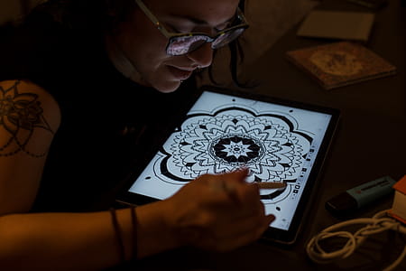 Woman Draws Mandala in Tablet Computer thumbnail