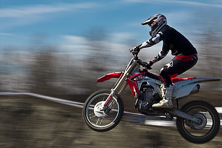 man riding motocross dirt bike thumbnail
