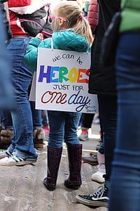 girl wearing Heroes text banner thumbnail