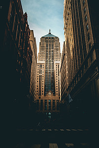 person walking in middle of buildings thumbnail