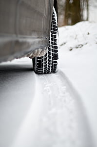 selective focus photography of vehicle on snow at daytime thumbnail