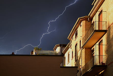 brown brick house under lightning thumbnail