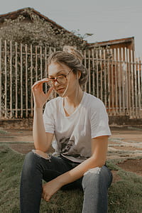photo of woman holding her eyeglasses thumbnail