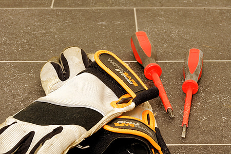 pair of white-and-black gloves on gray surface thumbnail