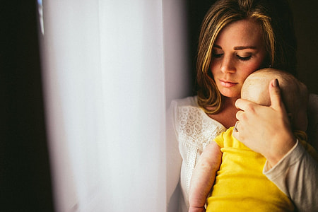 Mother holding baby thumbnail