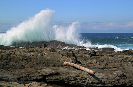 cliff and sea waves photo at daytime thumbnail