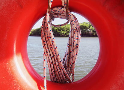 red lifebuoy and white rope thumbnail