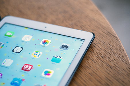 silver iPad on brown wood thumbnail