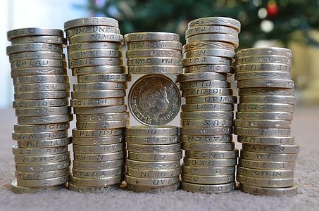 pile of round silver-colored coins selective focus photography thumbnail