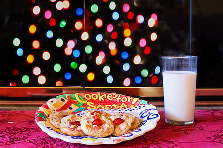 cookies on plate beside glass filled with milk thumbnail