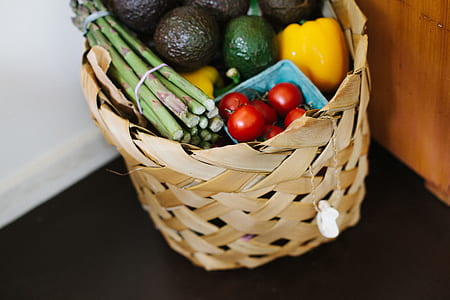 brown basket filled with vegetables on wooden table thumbnail