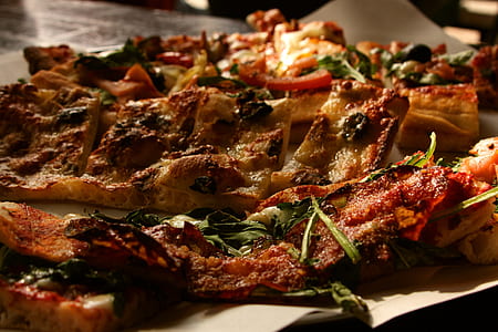 selective focus photography of sliced pizzas on top of white surface thumbnail