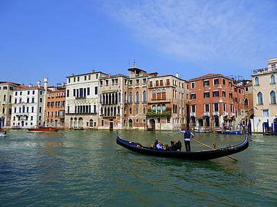 group of tourist riding gondola on Venice canal thumbnail