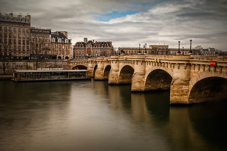white concrete bridge near buildings during daytime thumbnail