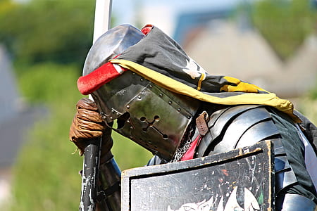 person wearing armor and helmet while holding shield and spear thumbnail