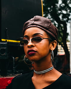 woman wearing black top standing near machine at daytime thumbnail