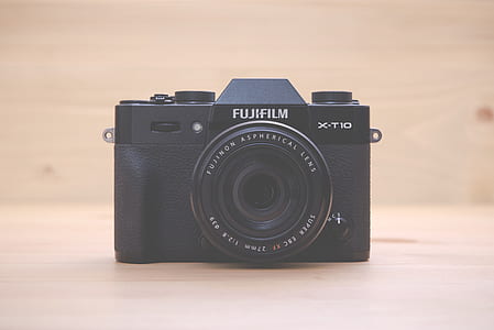 black Fujifilm X-T10 camera on brown wooden surface thumbnail
