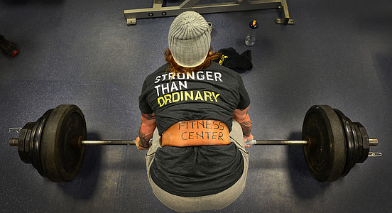 person holding barbells thumbnail
