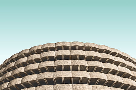 gray concrete building under teal sky thumbnail