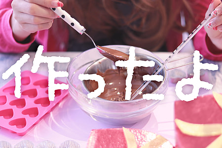 person holding spoon with chocolate syrup and bowl filled with melted chocolate thumbnail