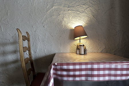 brown table lamp on tablecloth thumbnail