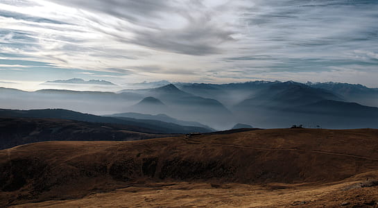 high-angle photography of mountain range with fog thumbnail