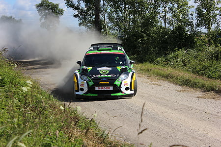 green and black car on brown road thumbnail