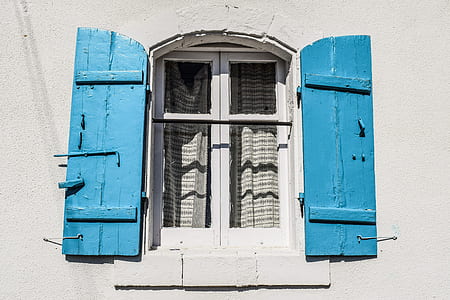 minimalist photography of white and blue opened wooden window thumbnail