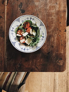 Vegetable Dish in Bowl on Brown Wooden Table thumbnail
