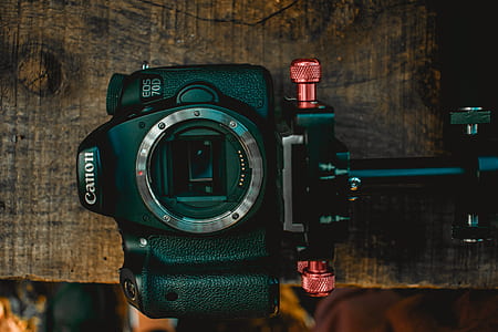 black Canon DSLR camera thumbnail