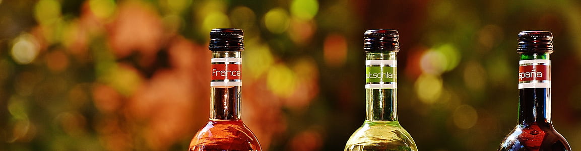 selective focus photography if three glass bottles thumbnail