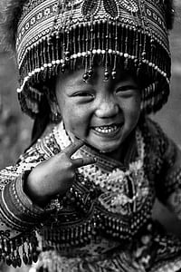 grayscale photo of girl wearing beaded suit smiling thumbnail