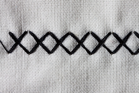 closeup photo of crisscross stitch thumbnail