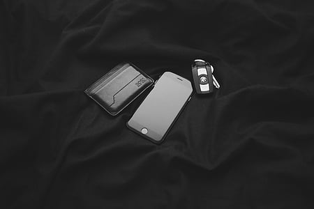 post-2014 iPhone beside car fob key and card knife thumbnail