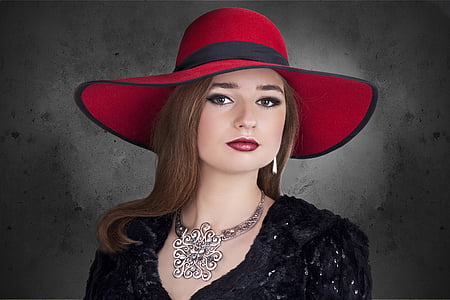 woman wearing black dress and red hat thumbnail