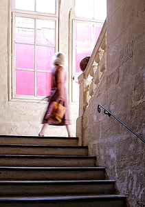 woman walking through the stairs thumbnail