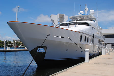 white yacht at dock thumbnail