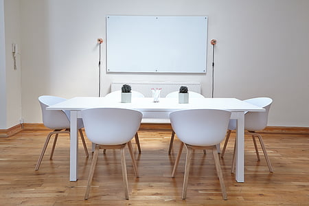 rectangular white wooden table and six chairs in white wall paint room thumbnail