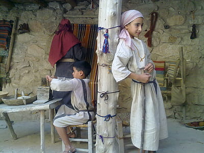 boy leaning on white wooden pillar thumbnail
