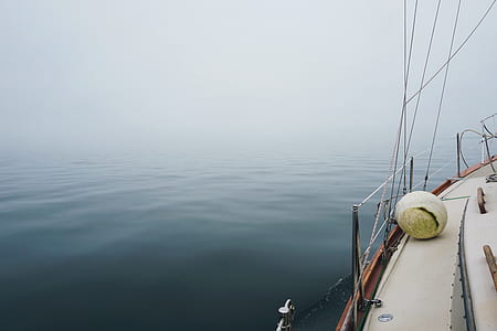boat on calm sea during daytime thumbnail